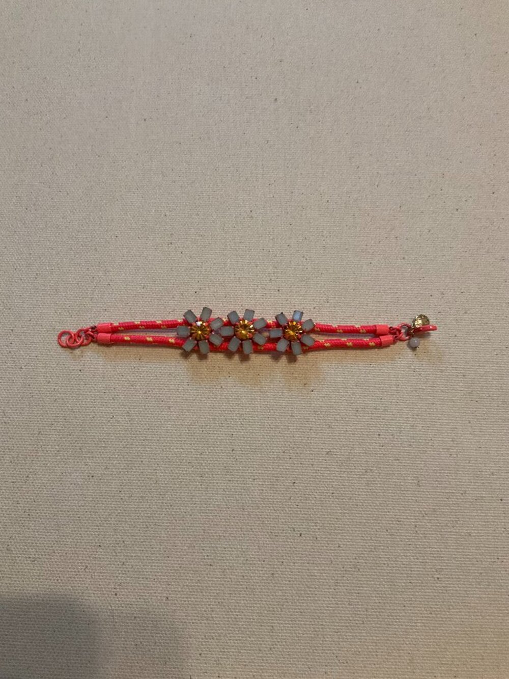 J.CREW CREWCUTS DOUBLE CORD BRACELET WITH CRYSTAL FLOWERS.